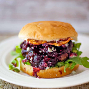Blueberry blue cheese bacon burger with arugula paired with Amavi Cellars Walla Walla Syrah